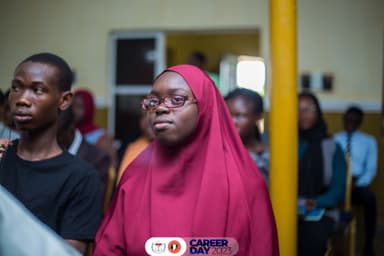 alhaja in a wine colored hijab